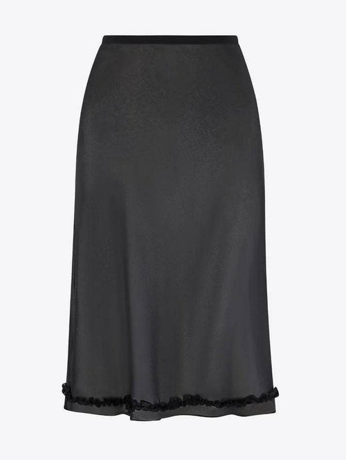 Black skirt with lace trim on a light gray background