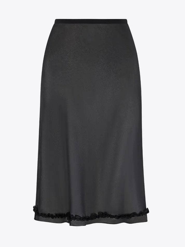 Black skirt with lace trim on a light gray background