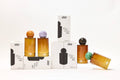 Set of perfume bottles and boxes on a white background