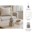 Decorative candle holder on a coffee table with text highlighting features