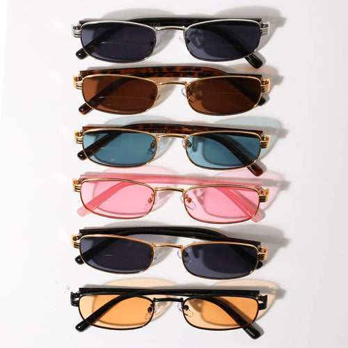 Set of six pairs of sunglasses with different colored lenses on a white background