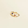gold ring with red and blue stones