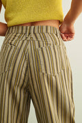 Striped pants worn by a person with a neutral background