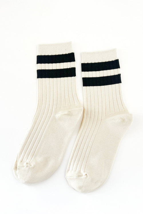 White socks with black stripes on a white background