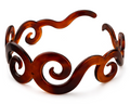 Decorative tortoiseshell bracelet with intricate designs on a white background, featuring the 'Parcelona' brand.
