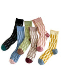 Set of colorful socks with various patterns on a white background