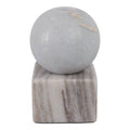 Marble sphere on a rectangular marble base against a white background