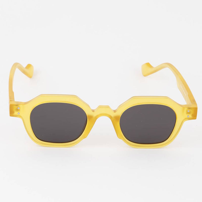 Yellow sunglasses with dark lenses on a white background