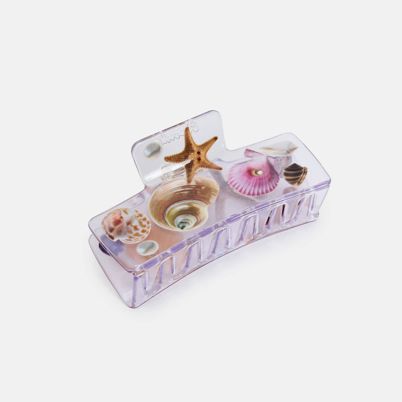 Decorative box with seashell and starfish design on a white background