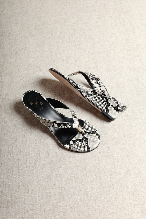 Aurora Snake-Embossed Leather Wedge Thong Sandals on white background