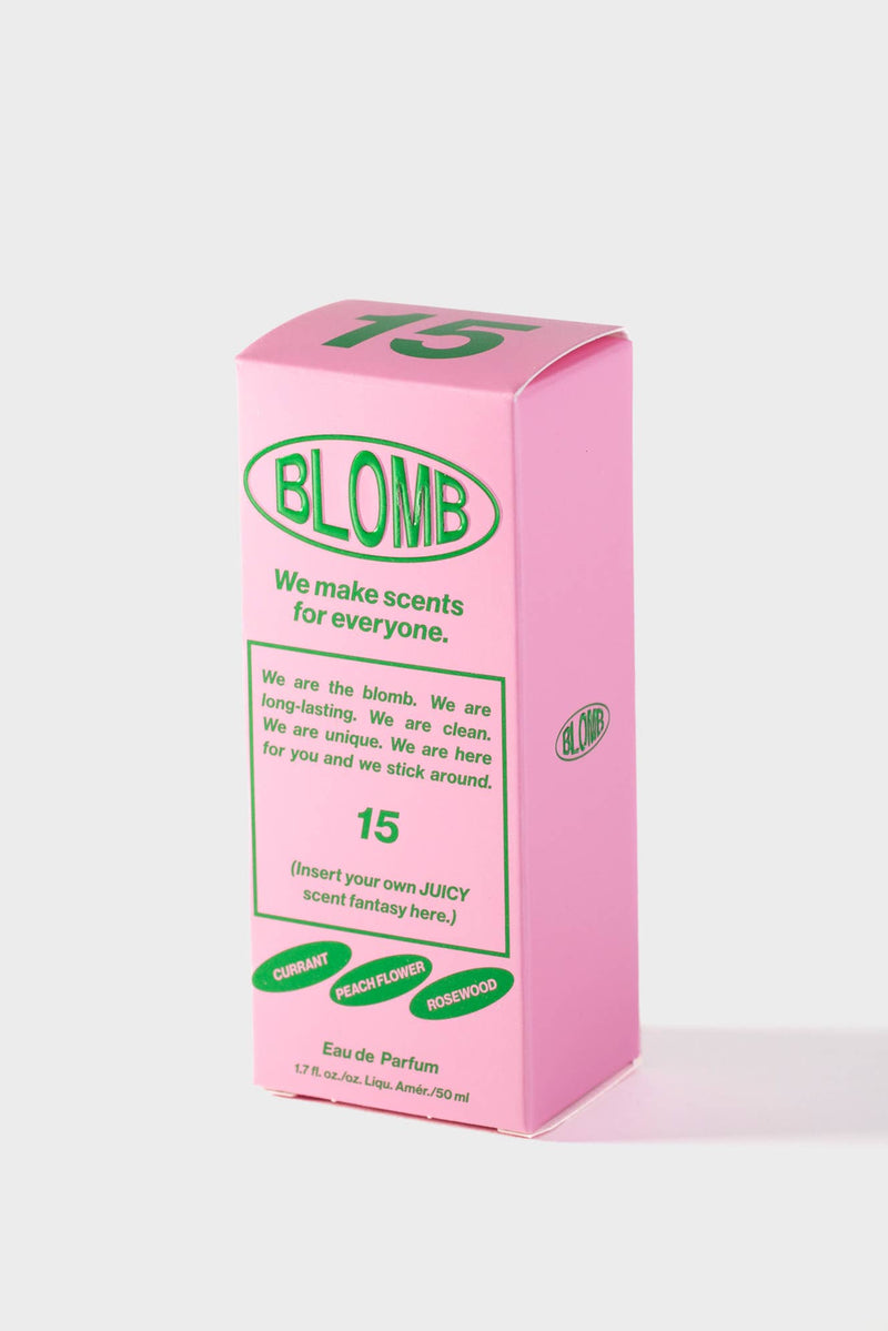 Pink box of Blombe perfume with green text on a white background