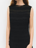 Black dress with ruffled texture on a white background