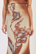 Skirt with floral pattern worn by a person on a white background