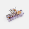 Transparent jewelry box with seashells and a starfish on a white background