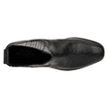 Black dress shoe with textured surface on a white background