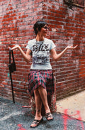woman wearing blue philly tee and plaid skirt