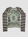 Long-sleeve shirt with black and white striped sleeves and a green center featuring intricate designs.