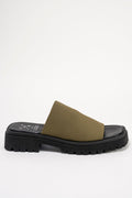 A single black platform slide sandal with a wide olive green fabric strap, shown from the side against a plain white background.