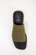 An olive green slide sandal with a black platform sole and a black insole featuring the white 'KMB' logo, shown from a top-down view on a white background.