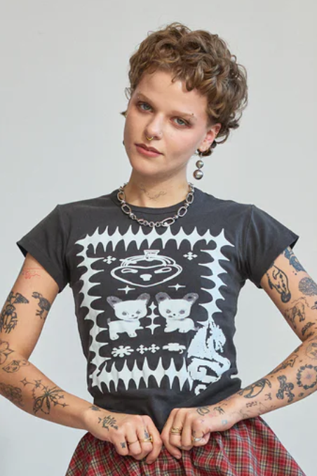 A person wearing a black t-shirt with a graphic design, featuring a mid-length fit, short sleeves, and a round neckline.
