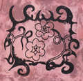 Pink tank top with black floral and leaf design on a light gray background