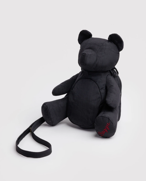 Black teddy bear-shaped backpack on a light gray background