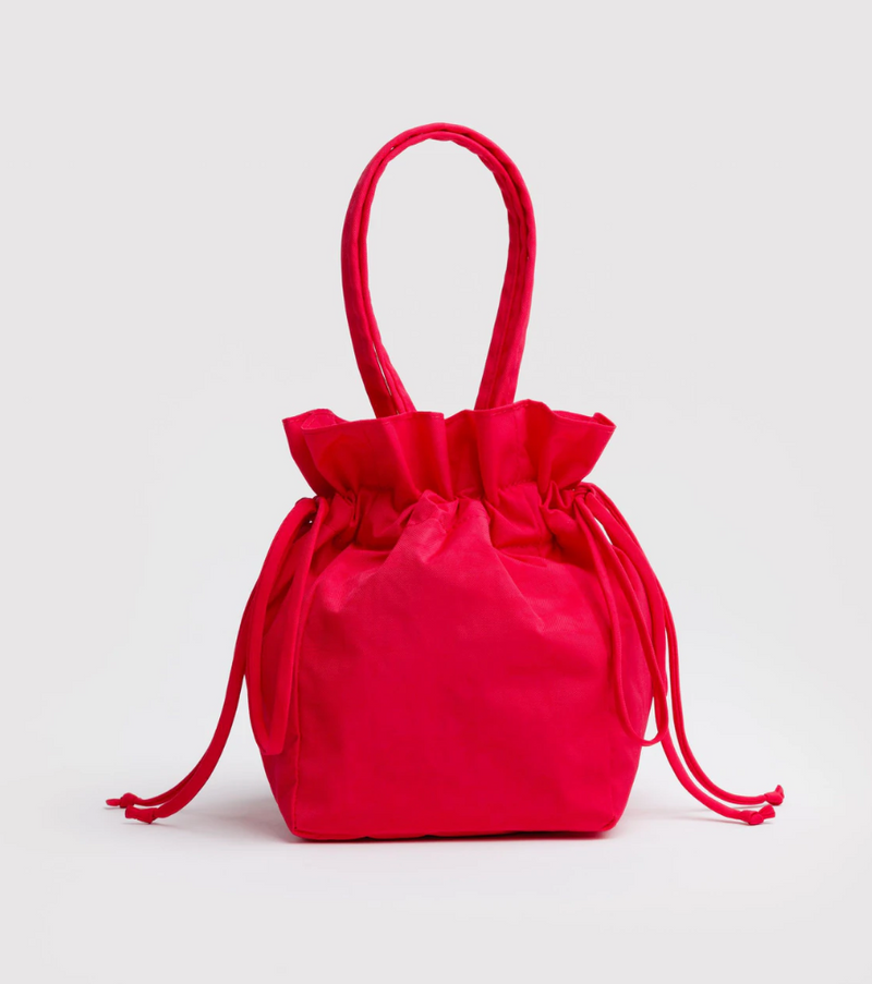 Red drawstring bag on a light gray background