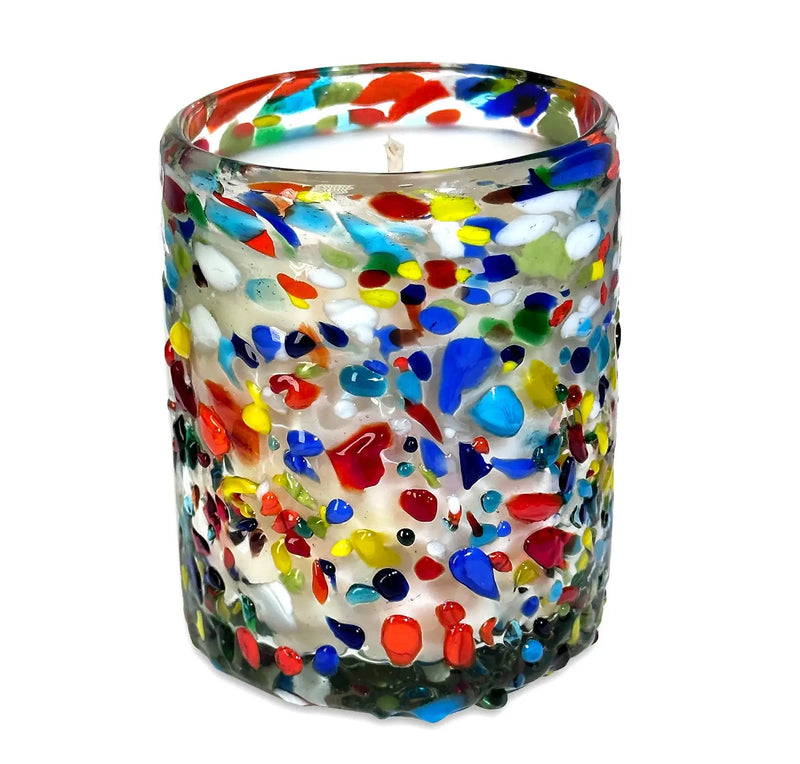 Colorful speckled glass candle on a white background