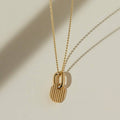 Gold ring and charm necklace