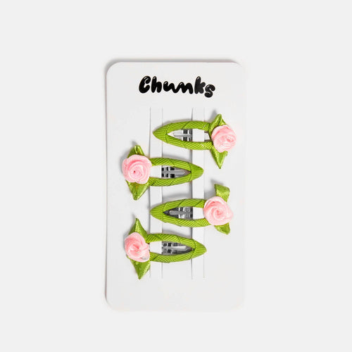 Set of green hair clips with pink flowers on a white card labeled 'Chunks'.