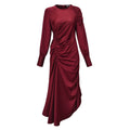A long-sleeve midi dress in deep burgundy with ruched detailing on the bodice and draped fabric cascading down the front, shown against a plain white background.