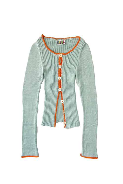Light blue cardigan with orange trim on a white background