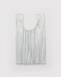 Silver fringe bag on a light gray background