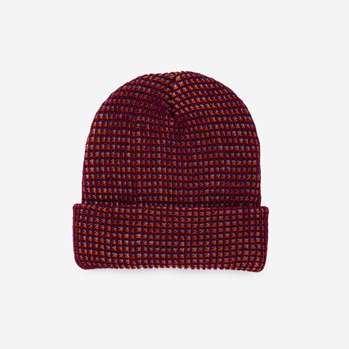 Woven patterned beanie on a light gray background