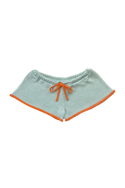 Light blue shorts with orange trim on a white background