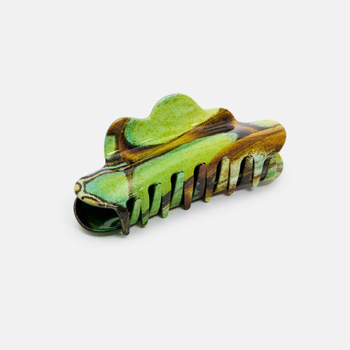 Green and brown hair clip on a white background