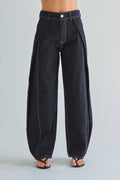 Black wide-leg jeans on a plain background
