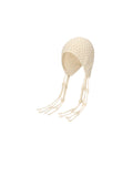 Crocheted baby bonnet with fringe on a white background