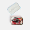 Set of hair pins in a tin with 'Glam' branding on a white background