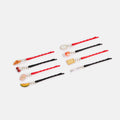 Set of hair sticks with various charms on a white background