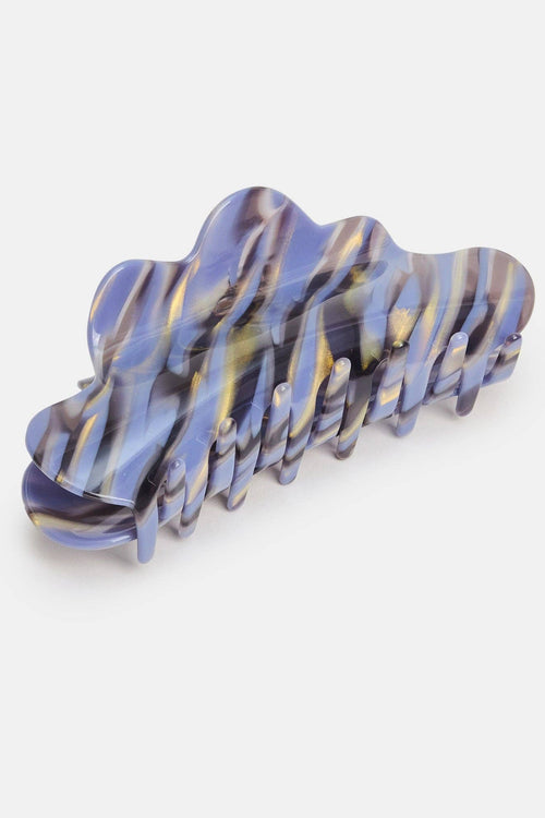 Blue and purple wavy hair clip on a white background