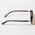 Black eyeglasses with gold accents on a white background