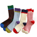 Set of colorful socks with different color combinations on a white background