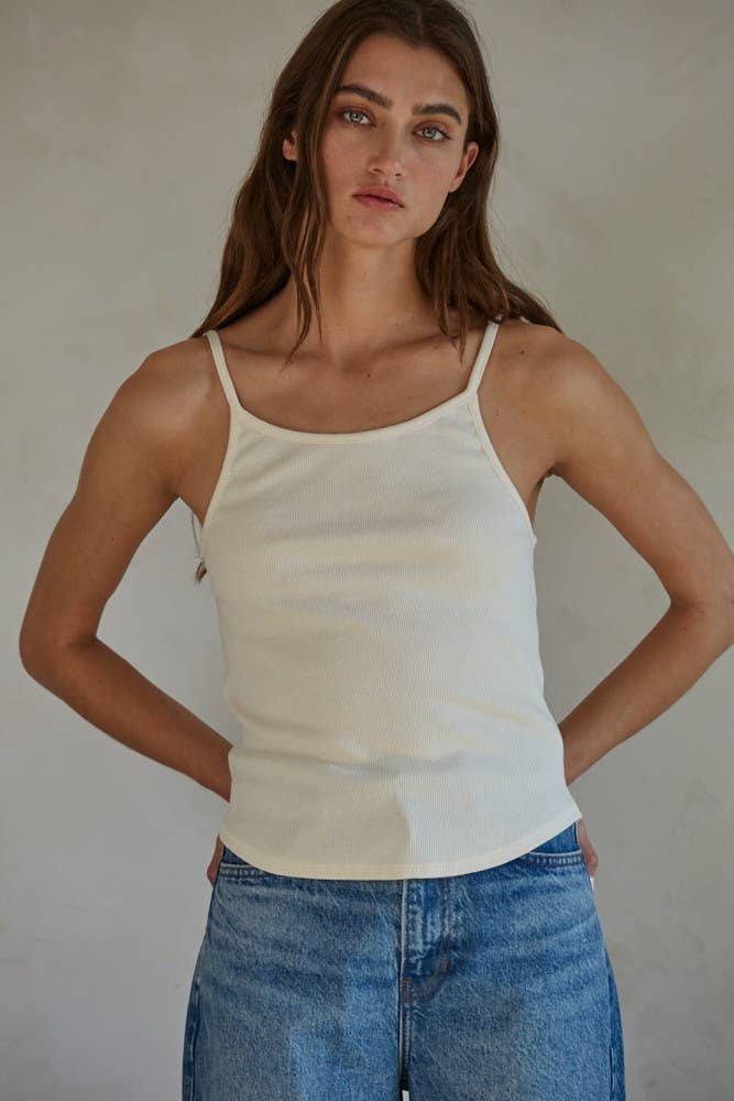 Woman wearing white thin strap top