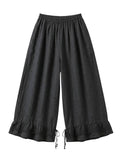 Black wide-leg cropped pants with an elastic waistband, drawstring hem, and ruffled lace trim, shown against a plain white background.