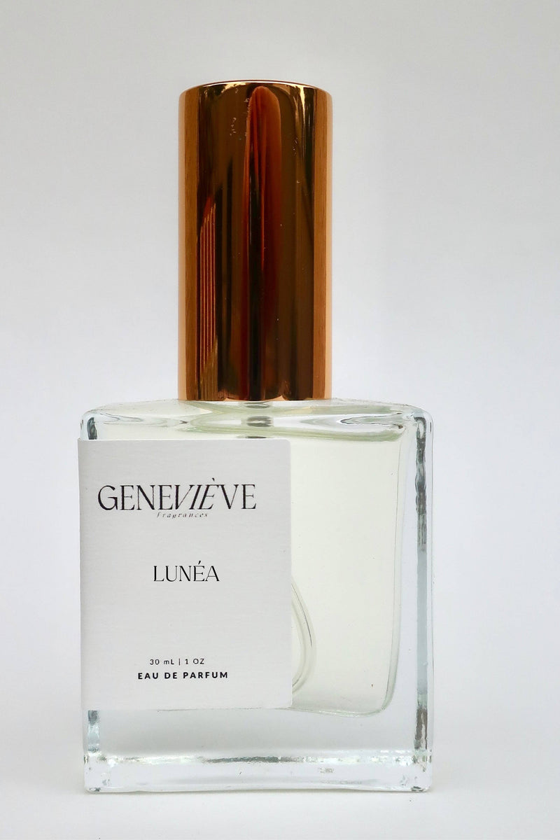 Perfume bottle with gold cap on a white background